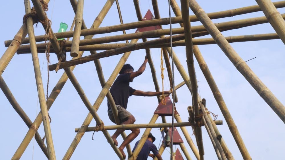 Two workers are seen actively involved in a construction work using bamboo in Nihoto village. (Morung file Photo | For representational purpose only)